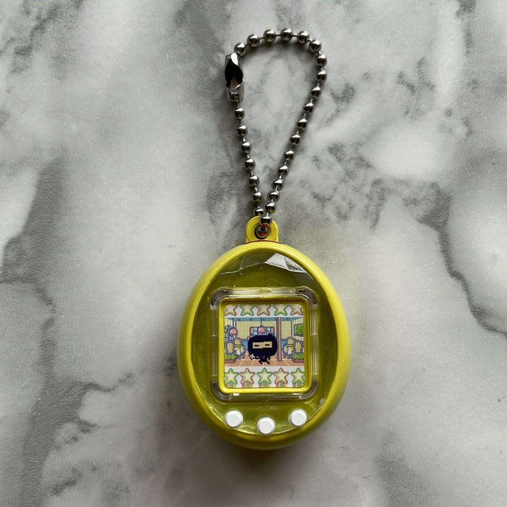 Yellow Tamagotchi gashapon keychain
